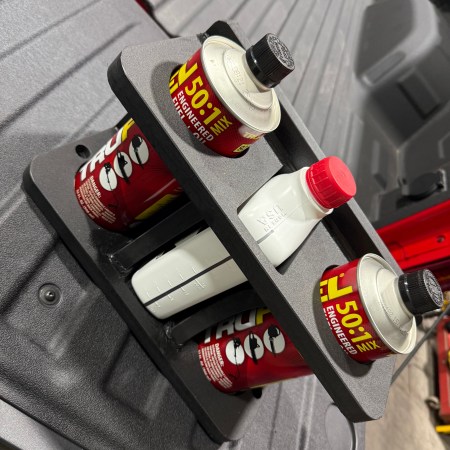 Chainsaw fuel bar can holder mount